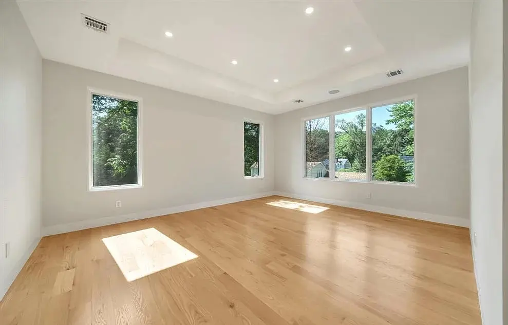 Hardwood, tile, vinyl, and laminate flooring installed in a renovated home