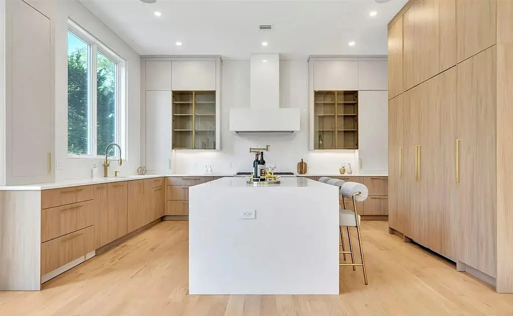 Kitchen remodeling with custom cabinets, island, and modern appliances