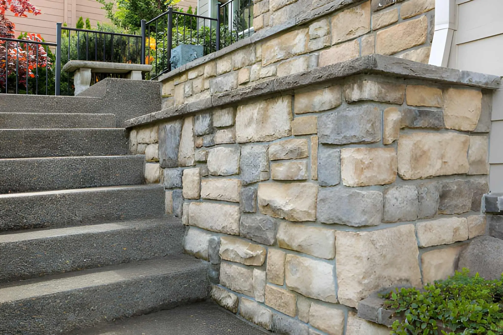 Decorative veneer stone installed on exterior and interior surfaces